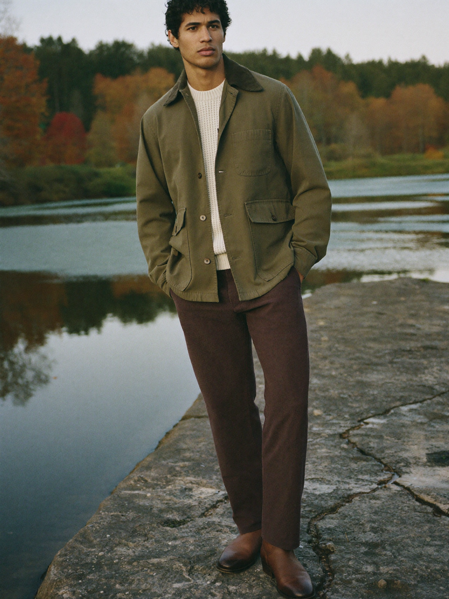 Olive field jacket on a lake shore