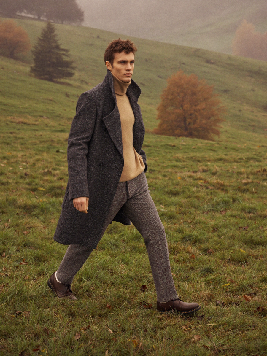 Charcoal peacoat on a misty hillside