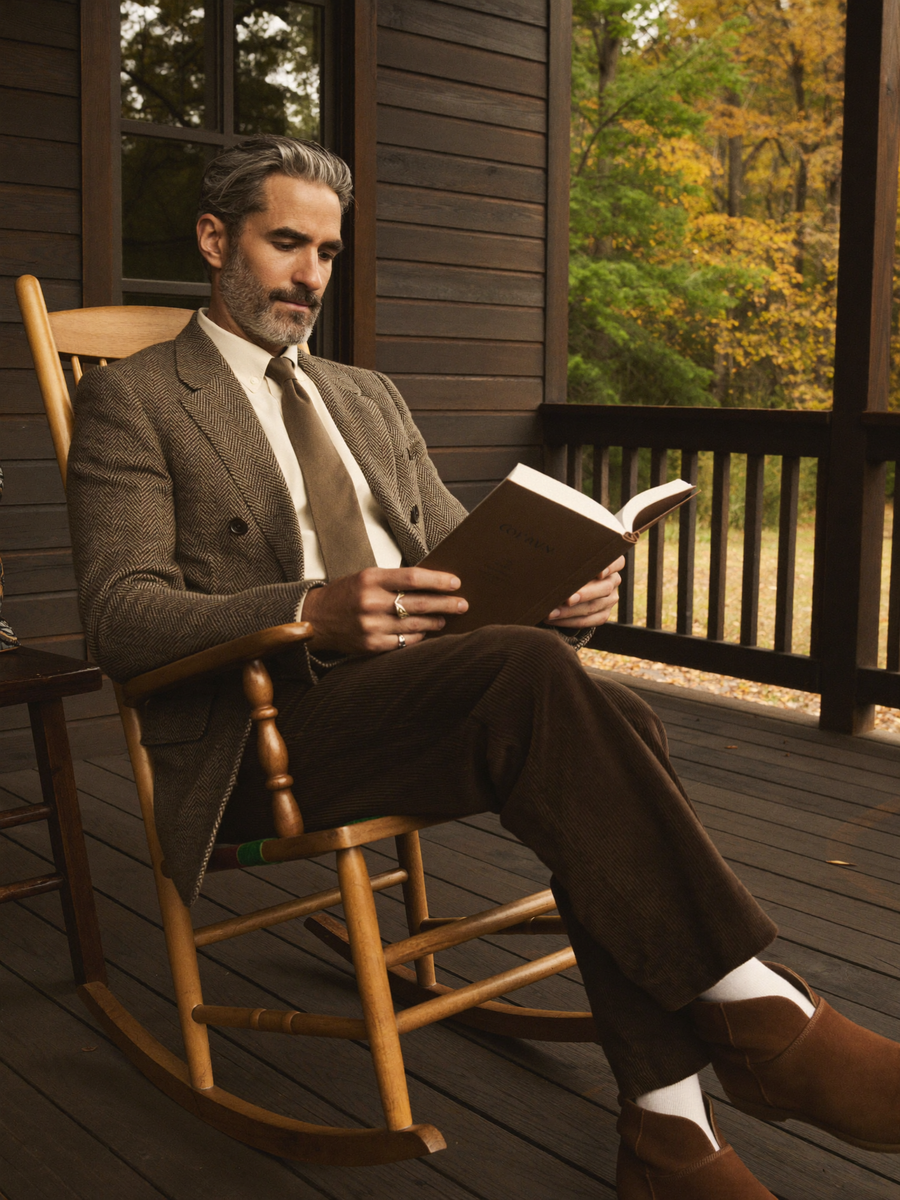 Tweed blazer on a cabin porch