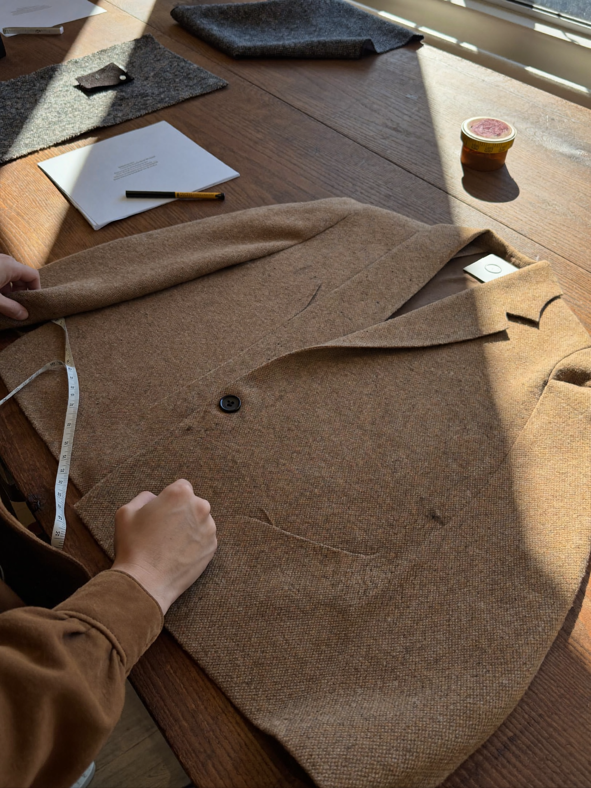 Designing a wool coat in the studio